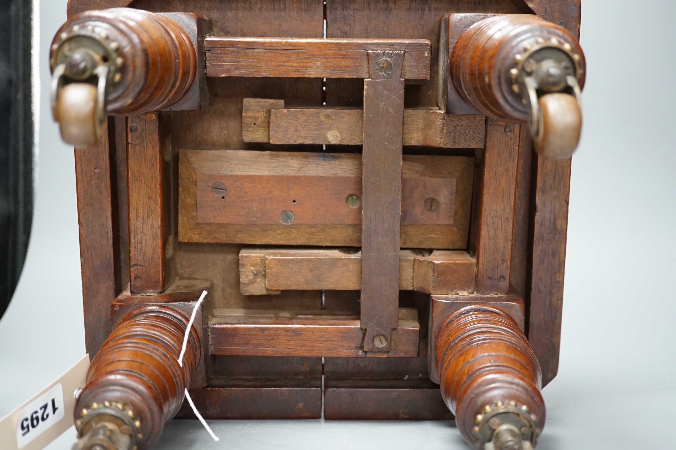 A late Victorian mahogany miniature extending table, possibly an apprentice piece, 24cms high.